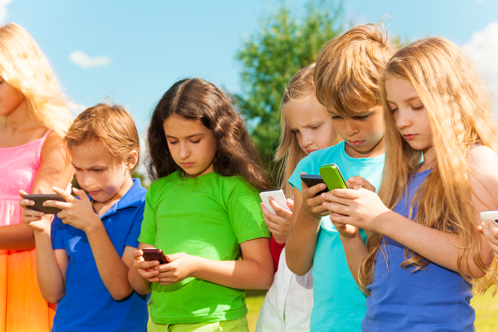 group of kids texting